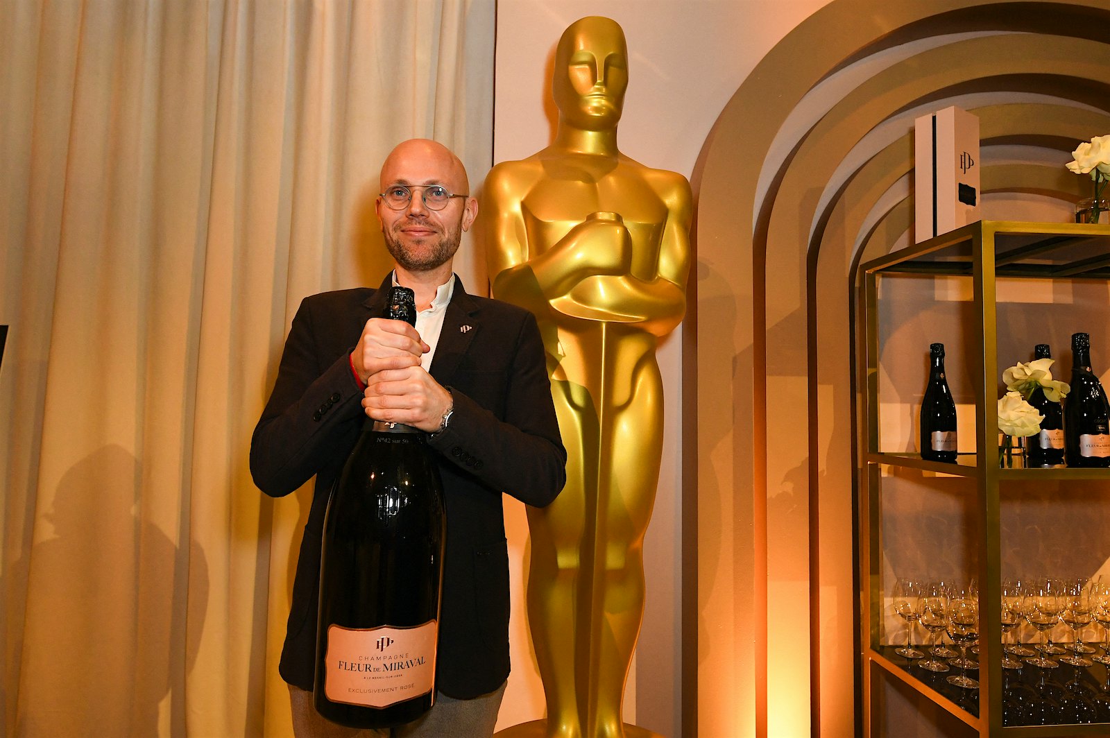 Fleur de Miraval Champagne chef de cave Alexis Blondel strikes a familiar pose at the 96th Oscars Governors Ball preview.